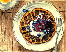 Waffles with creme, blueberries, and pomegranate