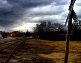 Railroad crossing and foul weather ahead