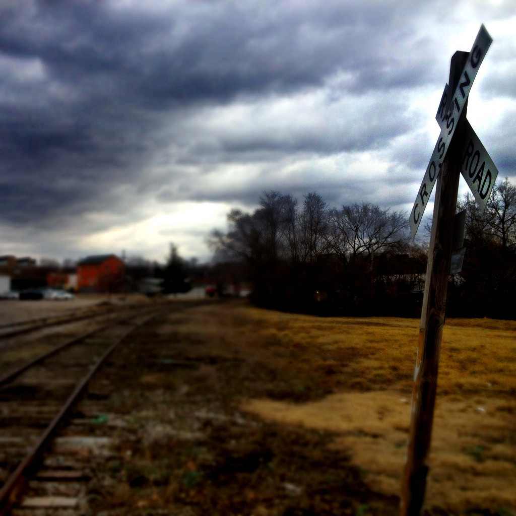 Railroad crossing and foul weather ahead