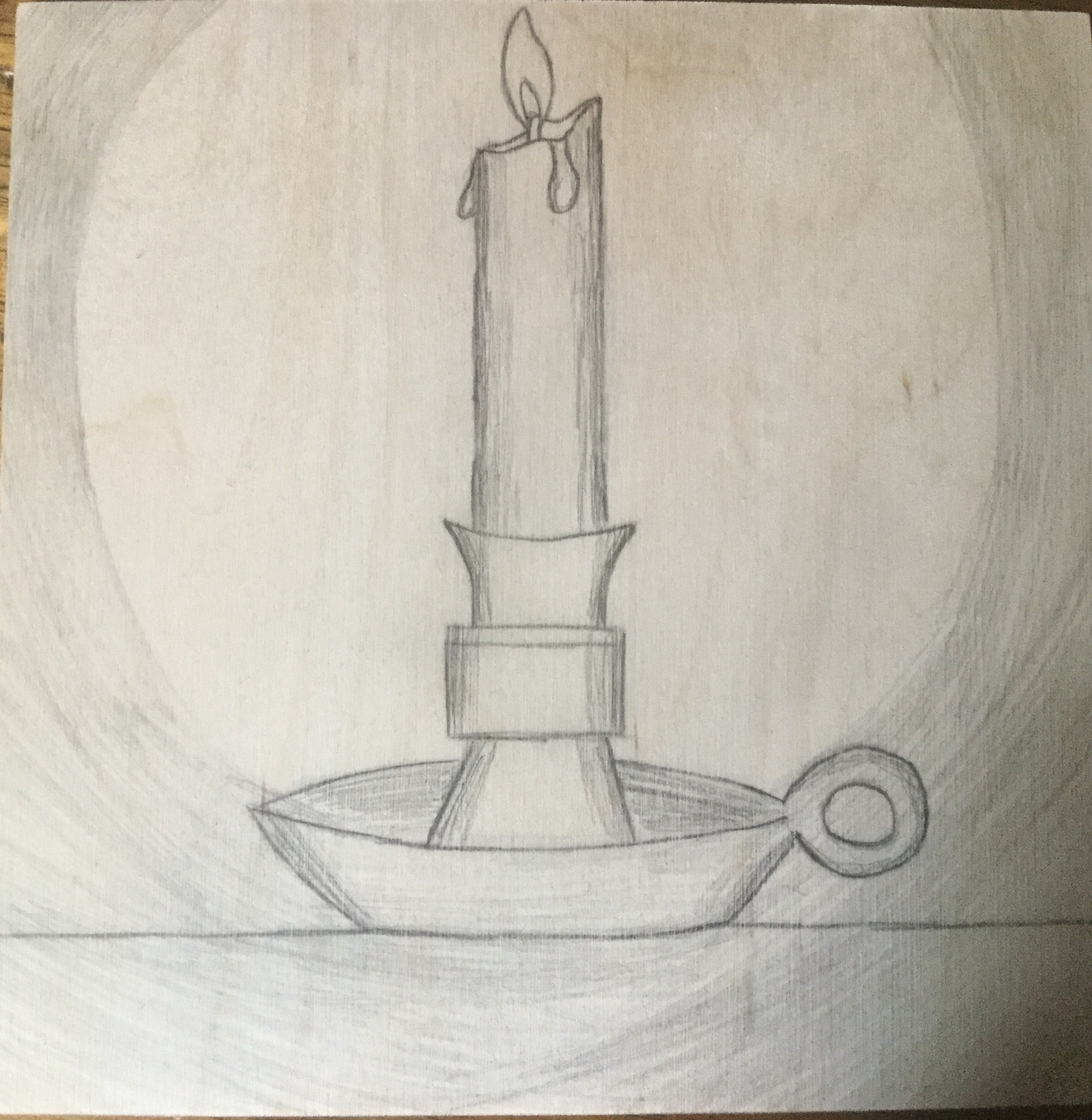 Candle on wood