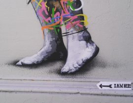 By the feet of a street art piece!