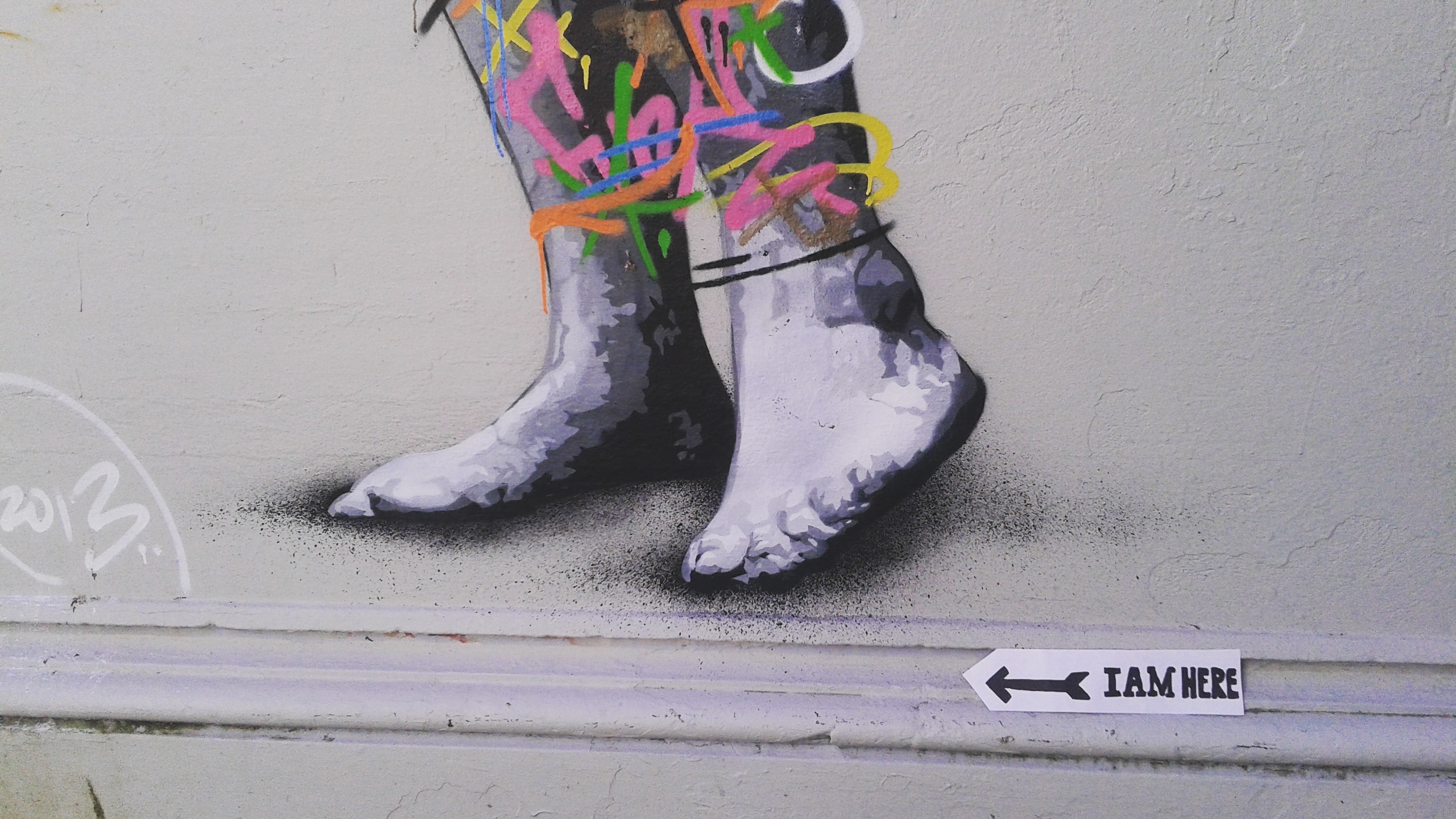 By the feet of a street art piece!